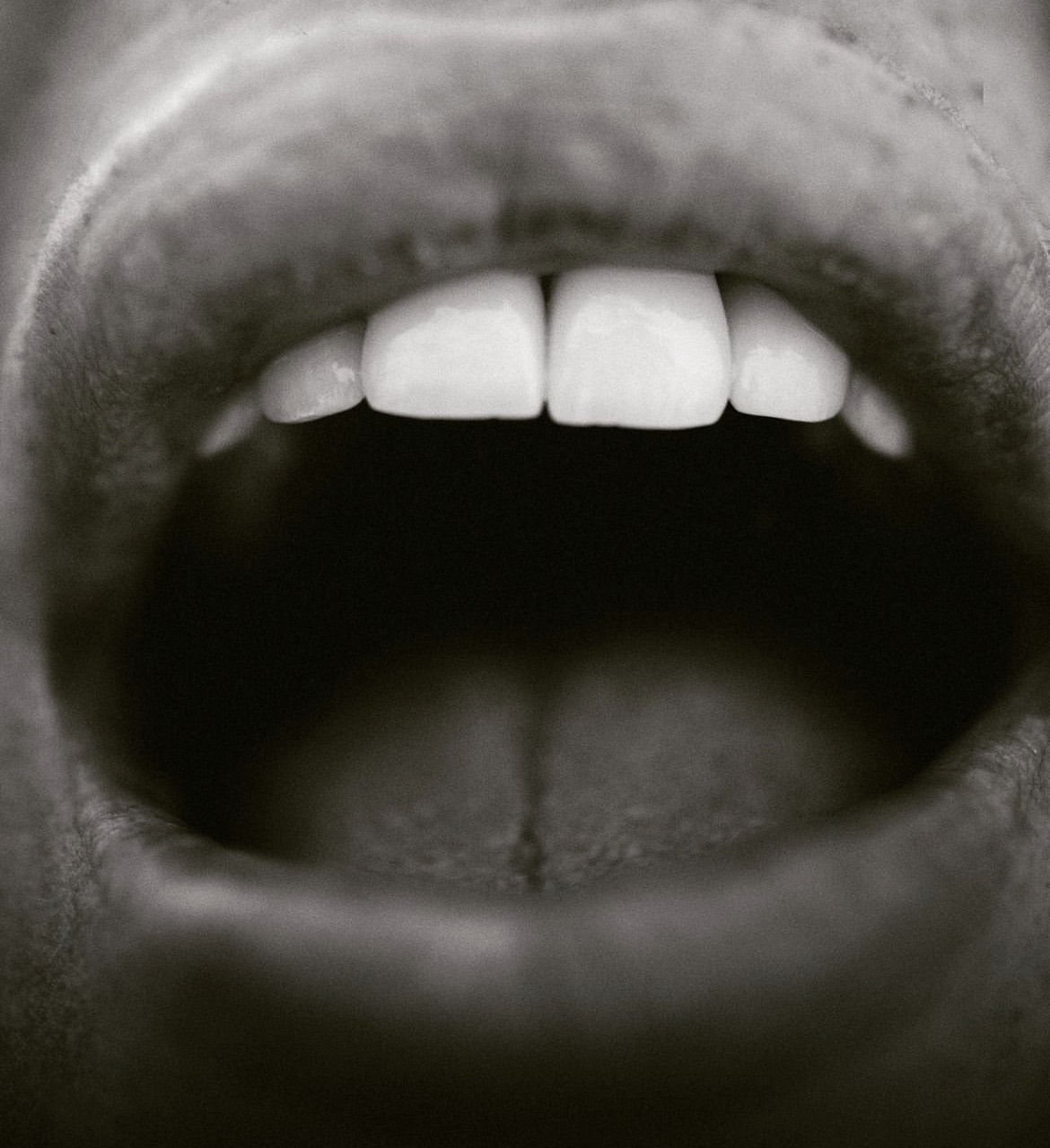 Black and white close-up of Vicentta's smile